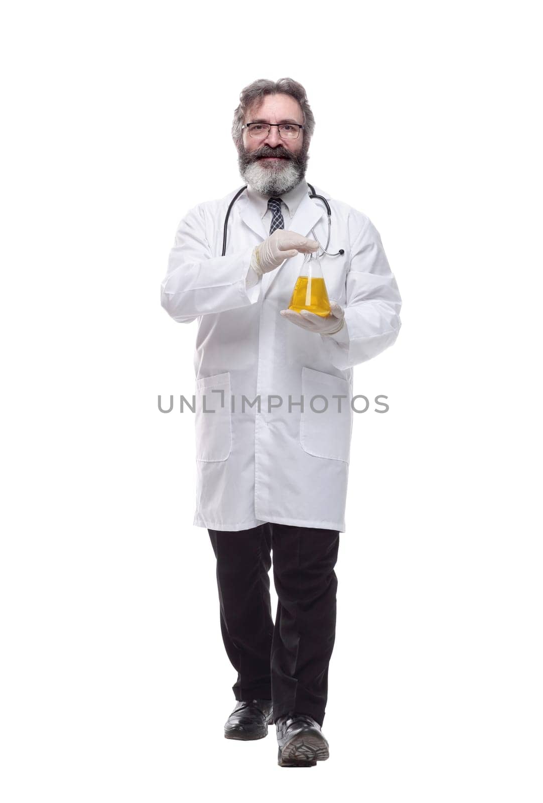 doctor with a laboratory flask striding forward . isolated on a white by asdf