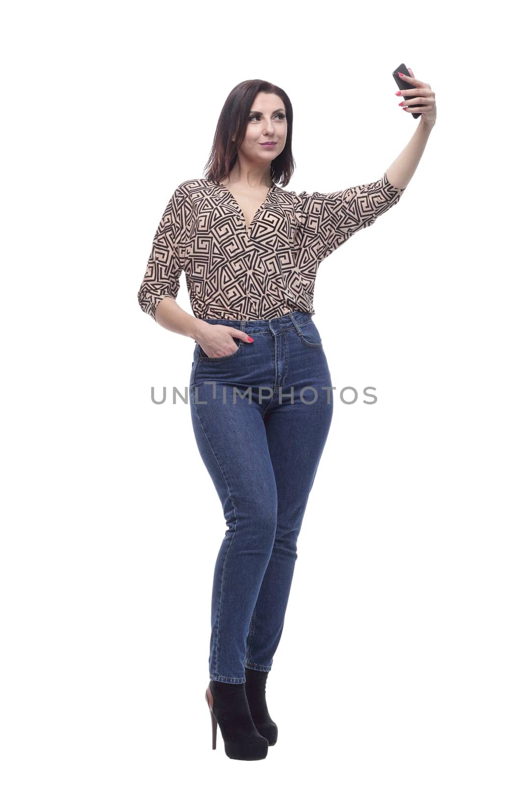 in full growth. attractive young woman with a smartphone. isolated on a white background.