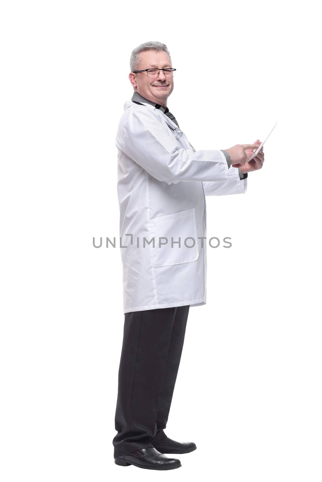 Full length portrait of male doctor using digital tablet isolated on white by asdf