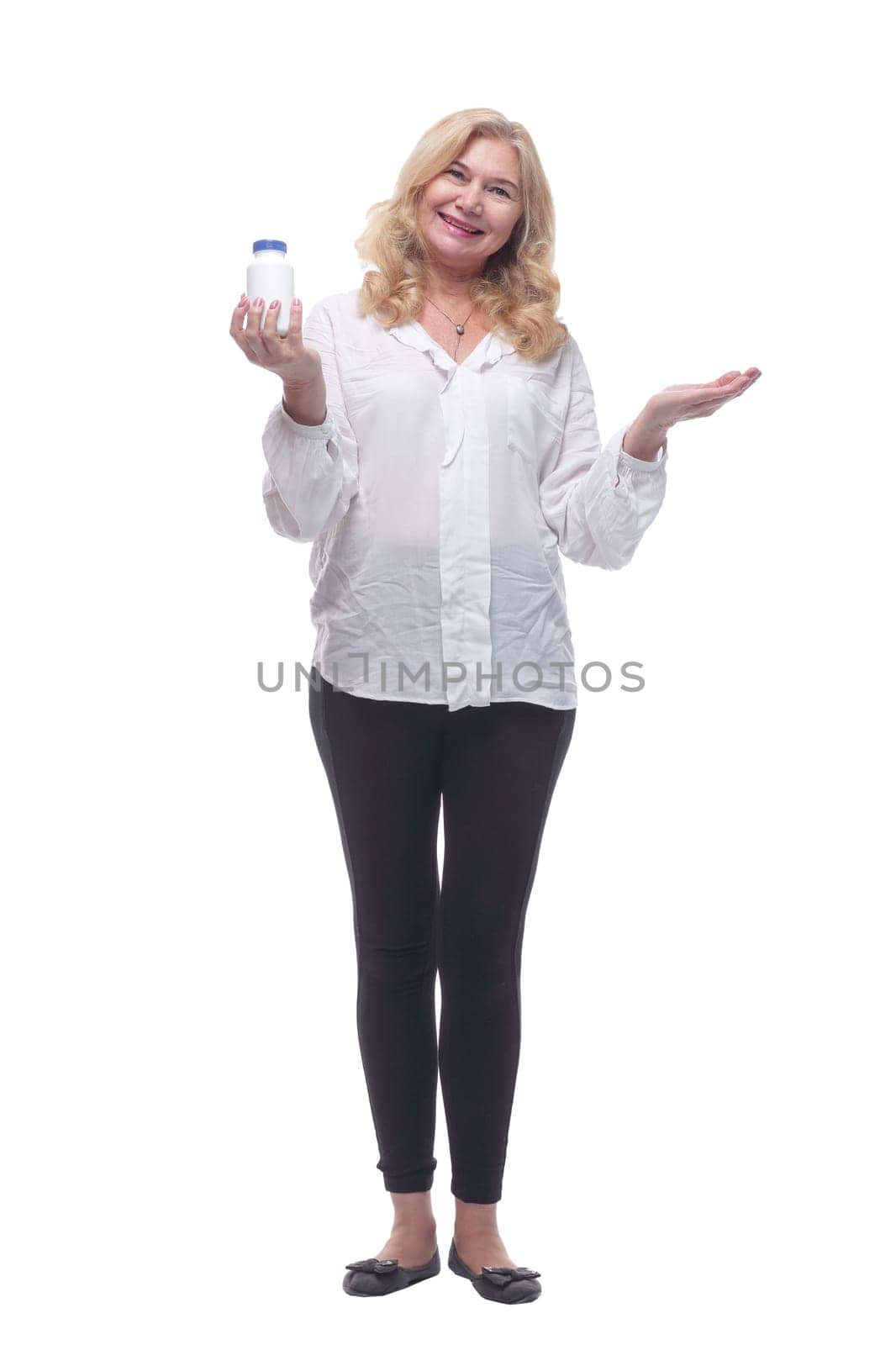 in full growth. smiling woman holds a bottle of antiseptic . isolated on a white background.