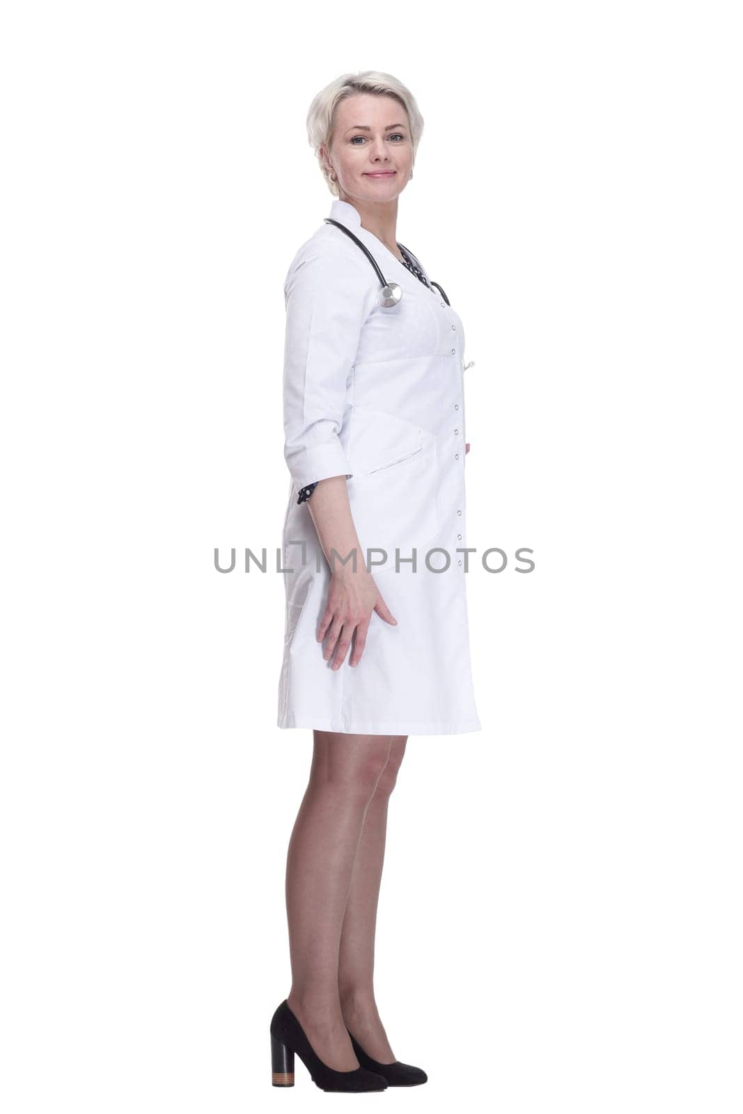 in full growth. young woman doctor looking at you . isolated on a white background.