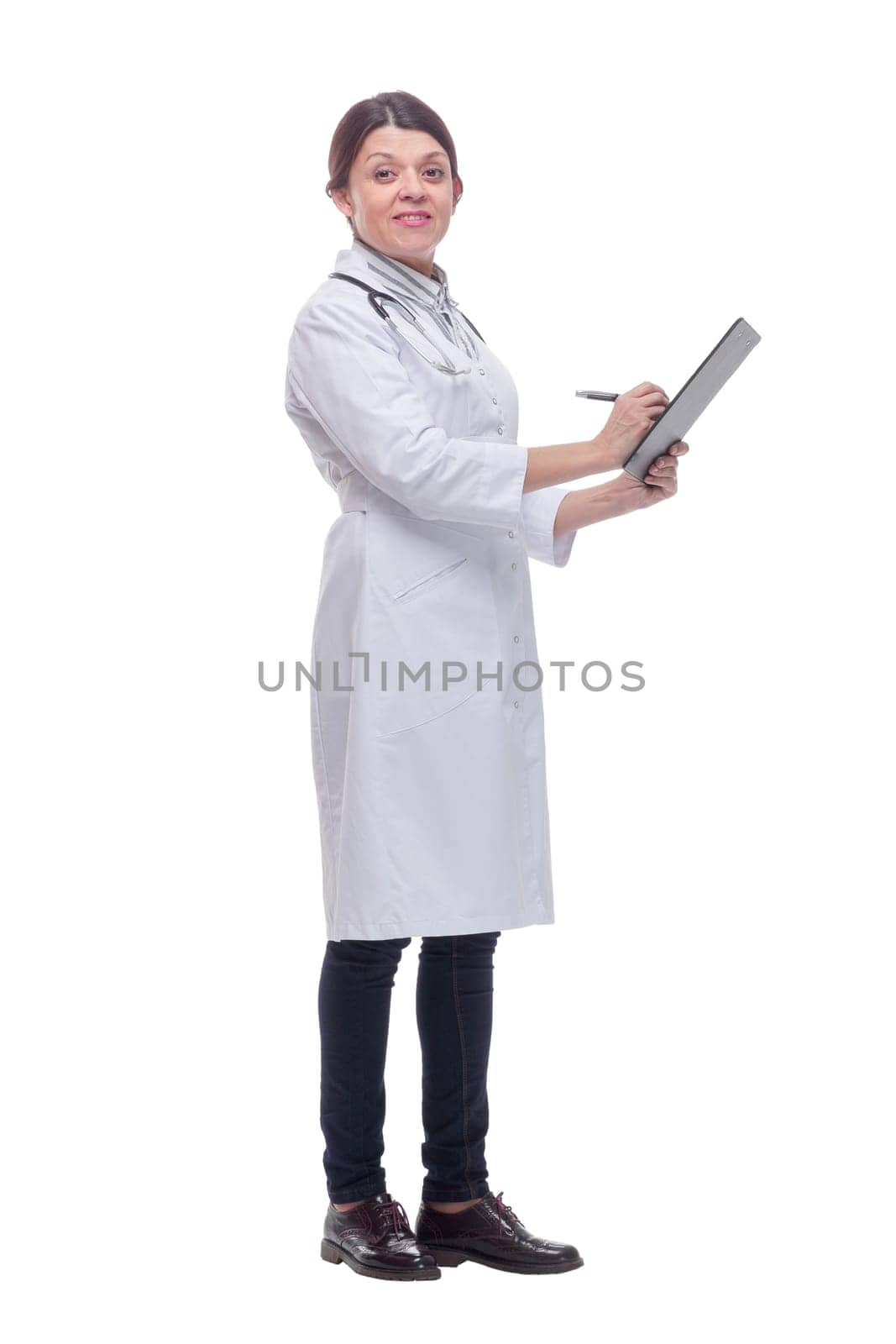 Smiling female doctor with stethoscope and clipboard looking at camera. Healthcare and medicine concept