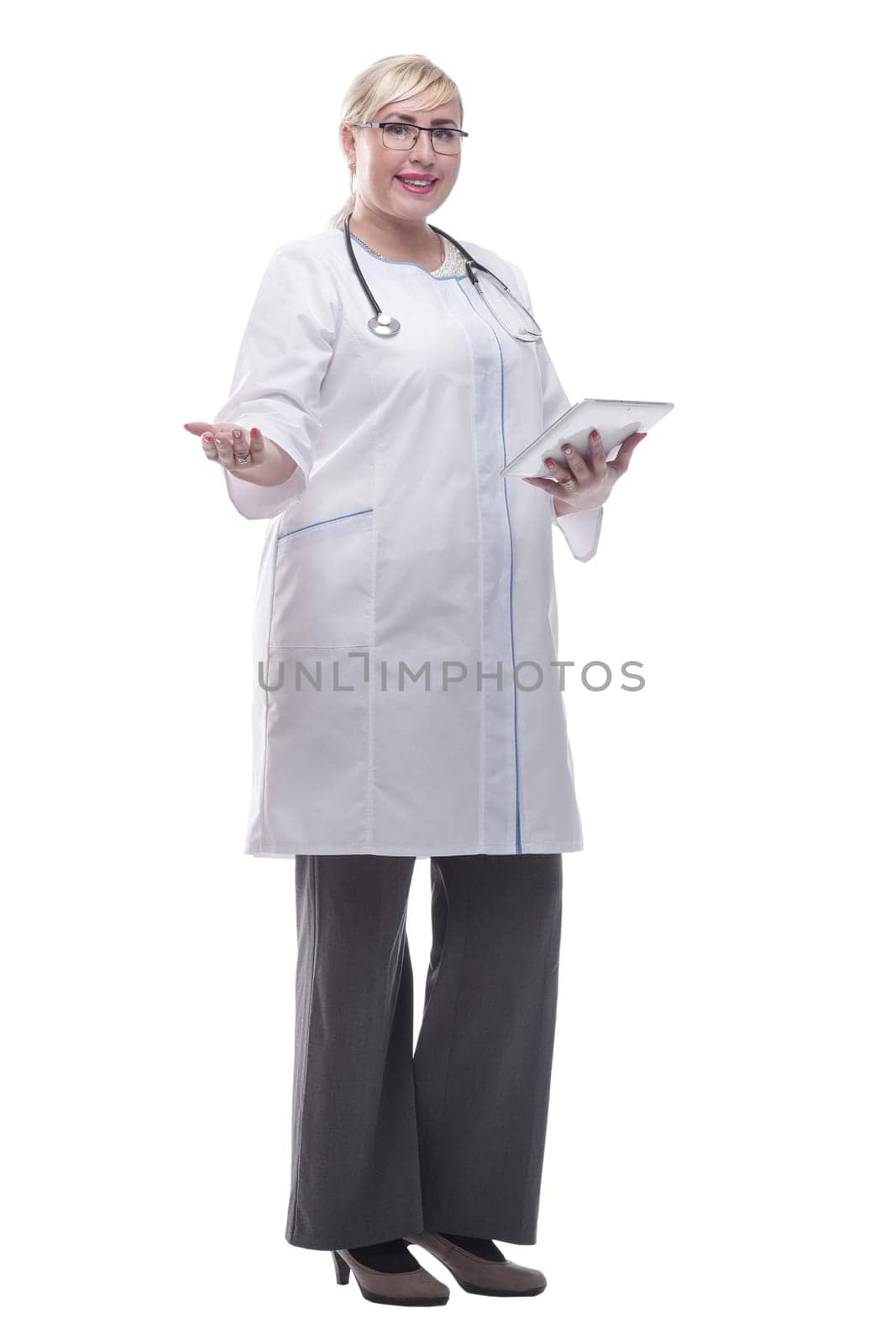 in full growth. smiling woman doctor with a digital tablet. isolated on a white background