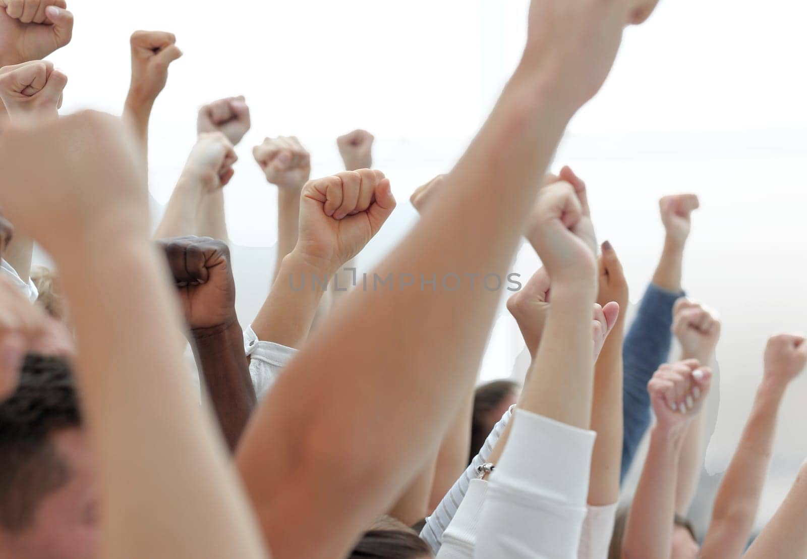 close up.cropped image of a group of young people holding their hands up
