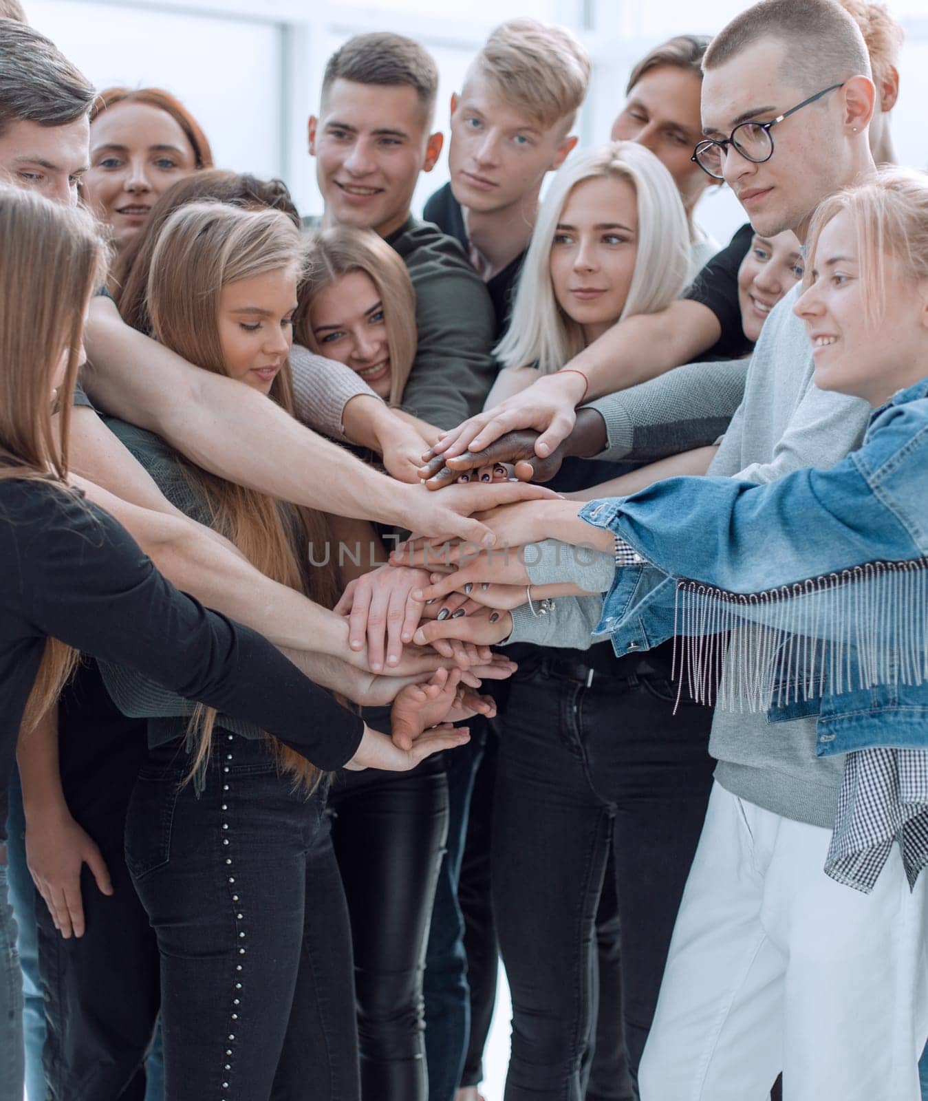 close up. a group of young people showing their unity. by asdf