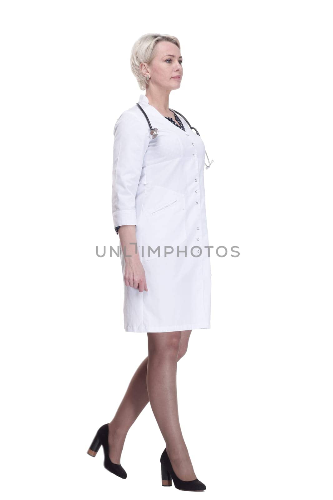 confident female doctor stepping forward . isolated on a white background. by asdf