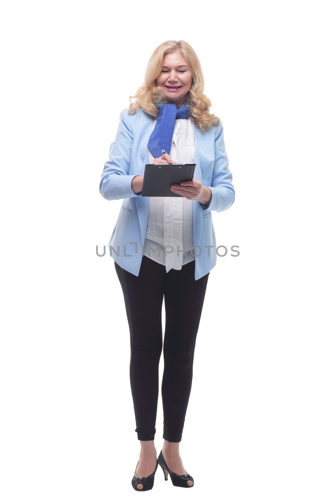 in full growth.Mature woman with clipboard . isolated on a white background.