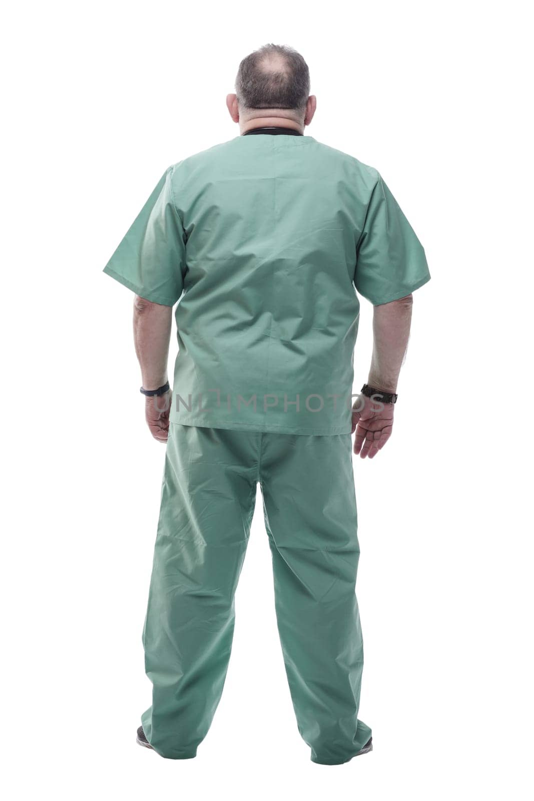 side view. Mature doctor looking at copy-space. isolated on a white background