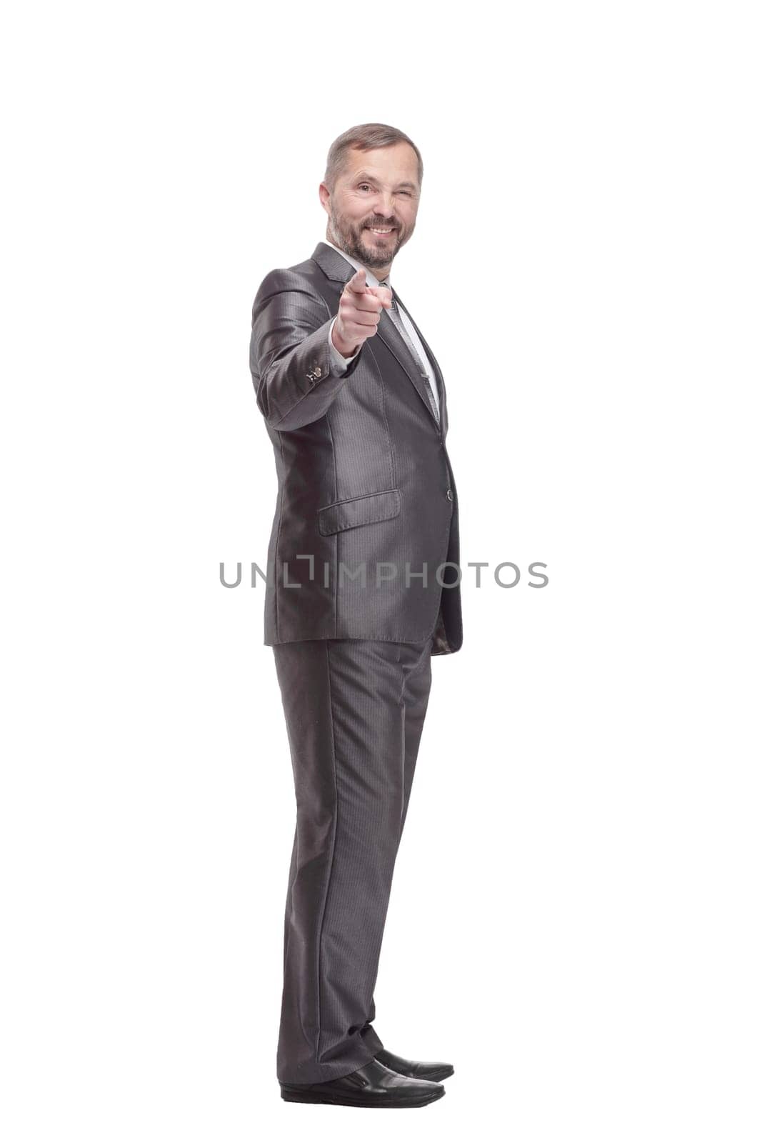 in full growth. handsome business man. isolated on a white background.