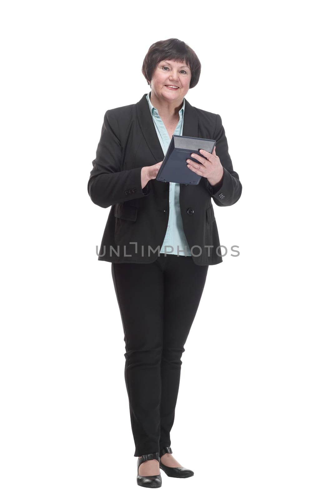 in full growth.smiling business woman with a calculator. isolated on a white background.