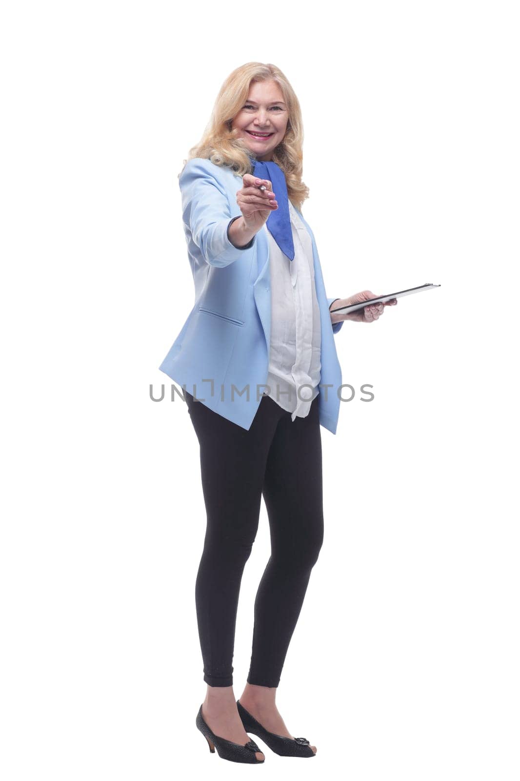 in full growth. smiling woman with clipboard pointing at you . isolated on a white background.