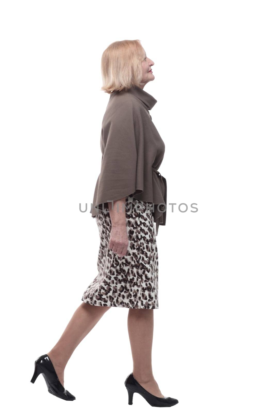 adult woman in a fashionable blouse striding forward . isolated on a white background.