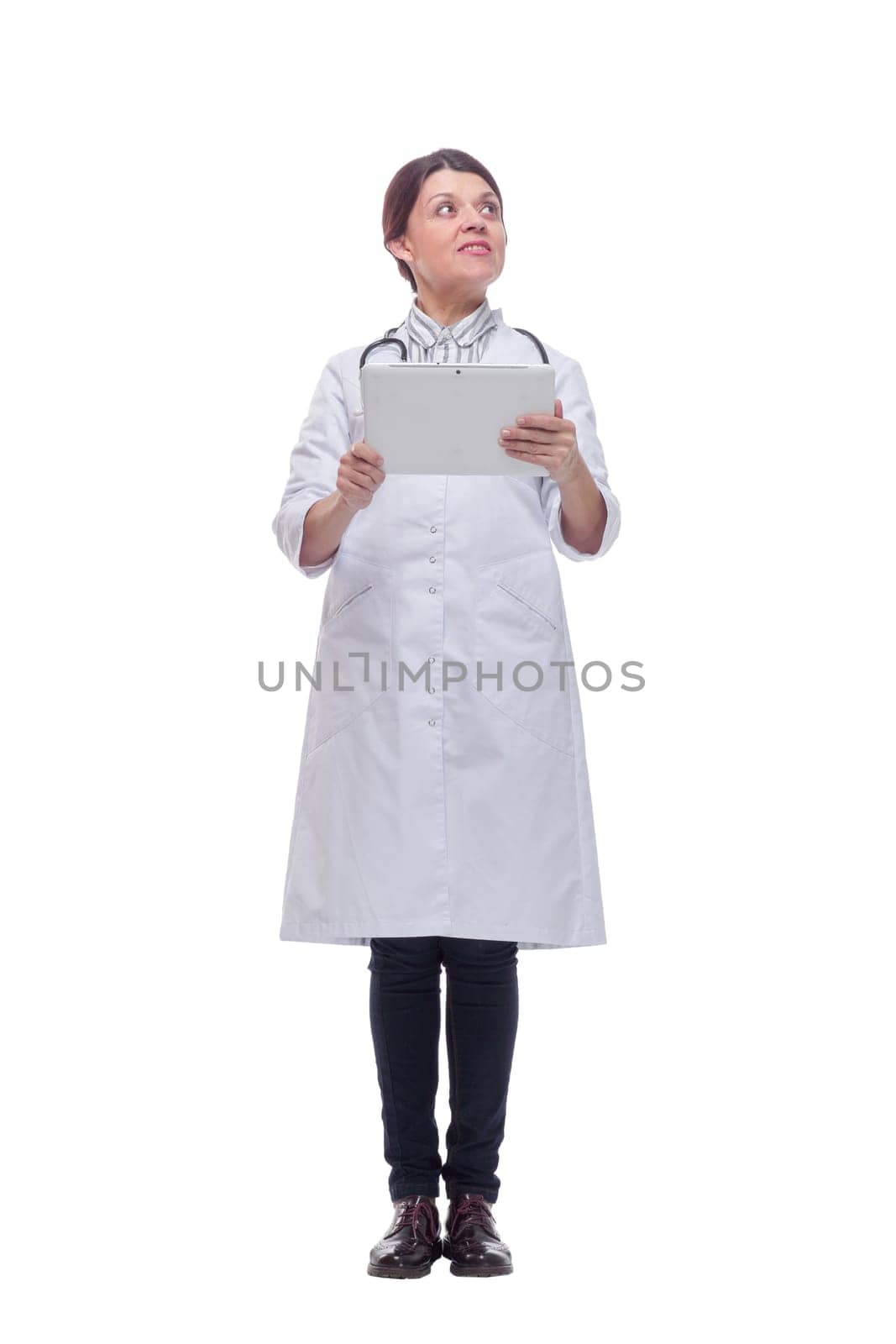 Portrait of a happy doctor working with a tablet, on white background