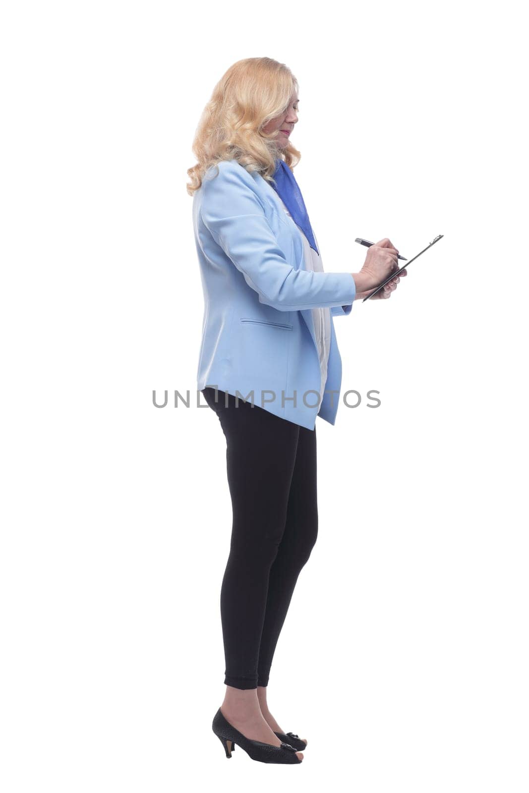 smiling woman pointing to a blank space in the clipboard . by asdf