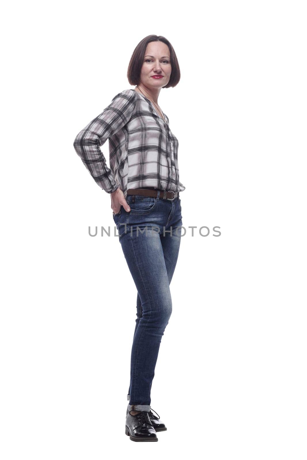 in full growth. attractive mature woman in jeans looking at you . isolated on a white background.