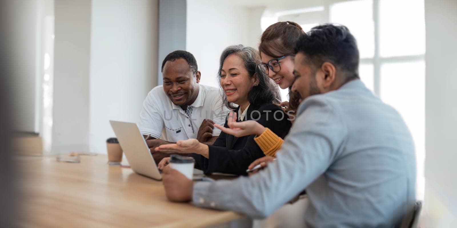 Group businesspeople diverse ethnicity on analysis financial data report paper on meeting table discussion to plan for data analysis at office concept diversity ethnicity.