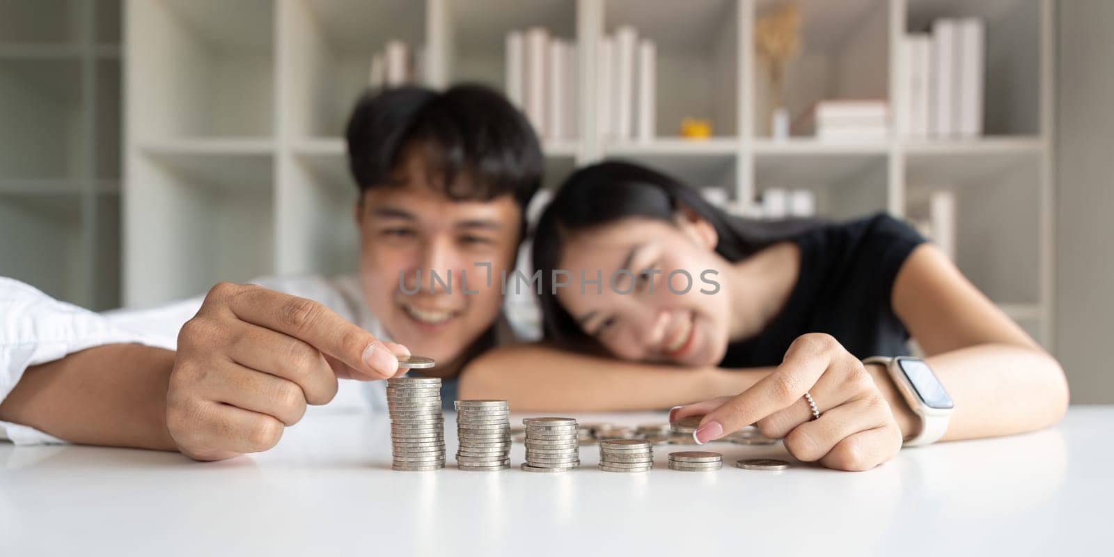 Saving money investment for future. Asian couple counting save money plan future budget. Saving investment banking concept by nateemee