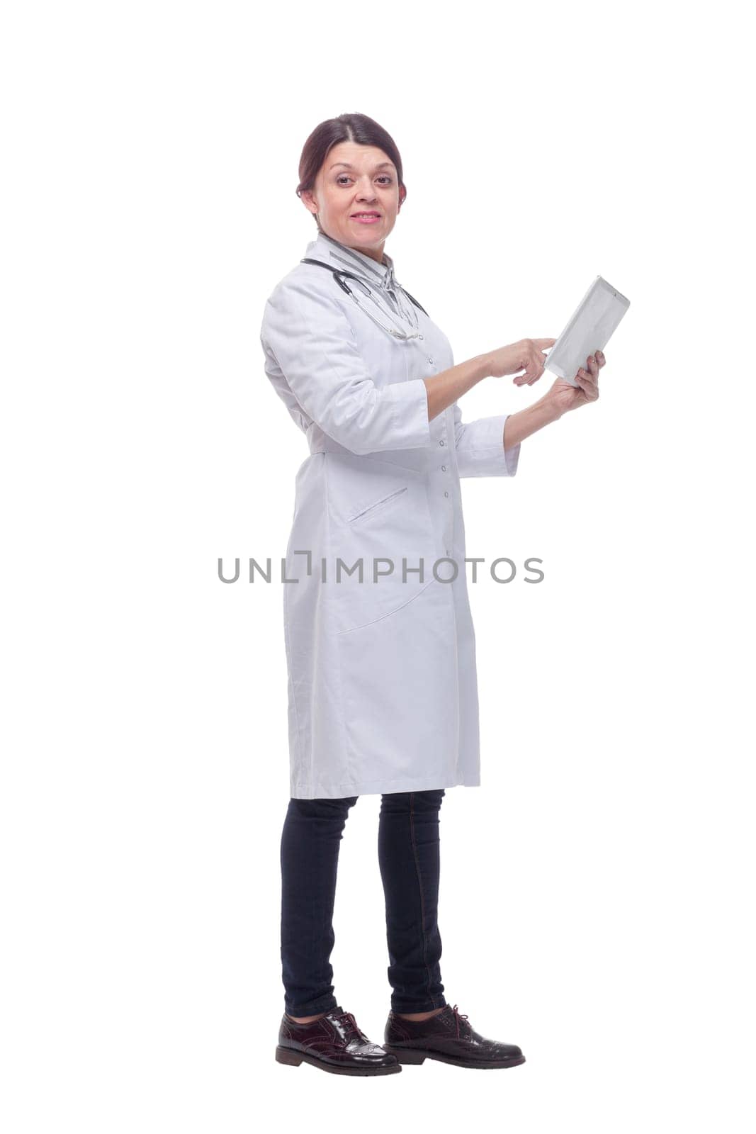 Side view of a doctor using a tablet computer - isolated over a white background