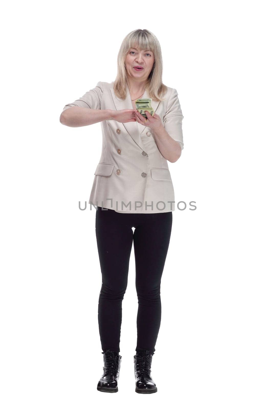 in full growth. very happy woman scattering a bundle of dollar bills. isolated on a white background.