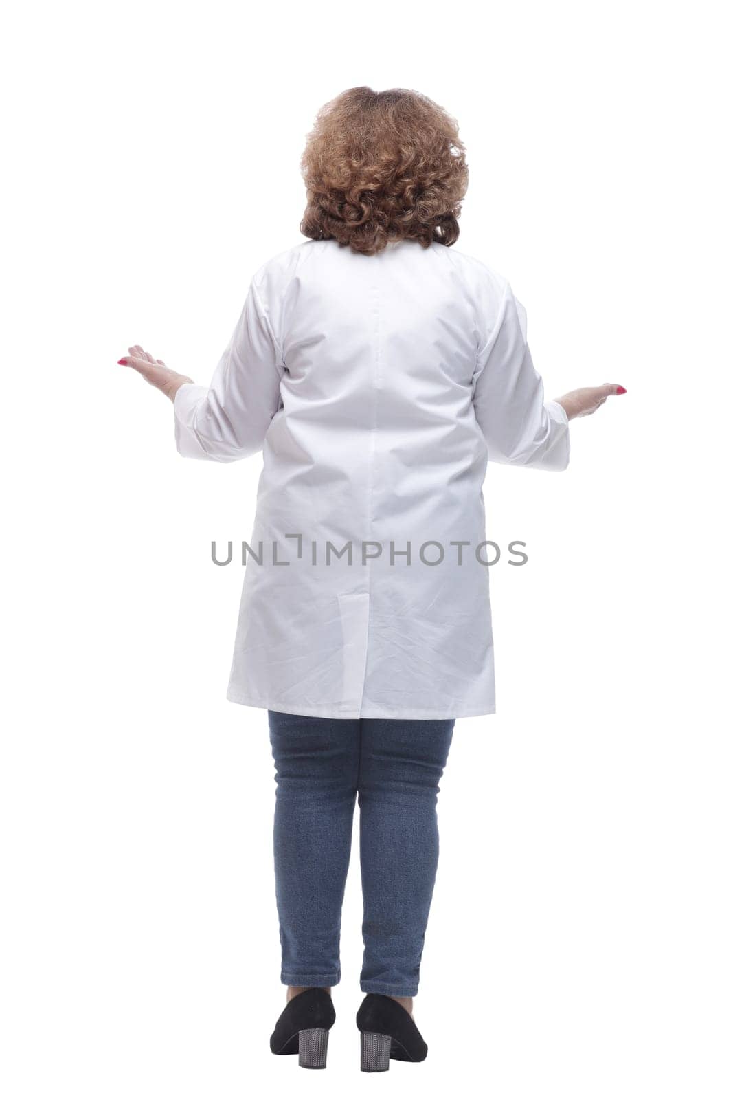 rear view. female doctor looking reading an ad on a white screen. isolated on a white background