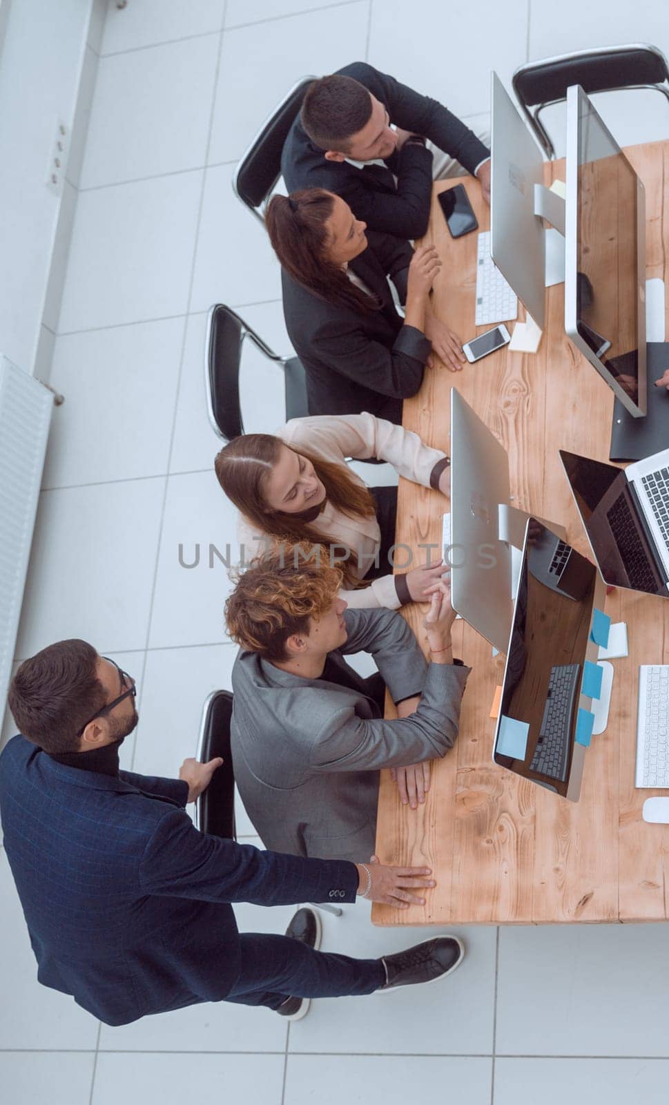 top view. business team discussing at a working meeting by asdf