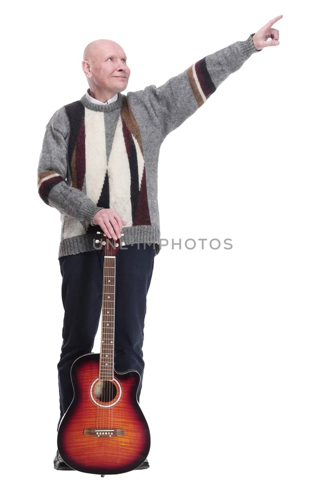 full-length. mature man with guitar in hand looking at you. isolated on a white background.