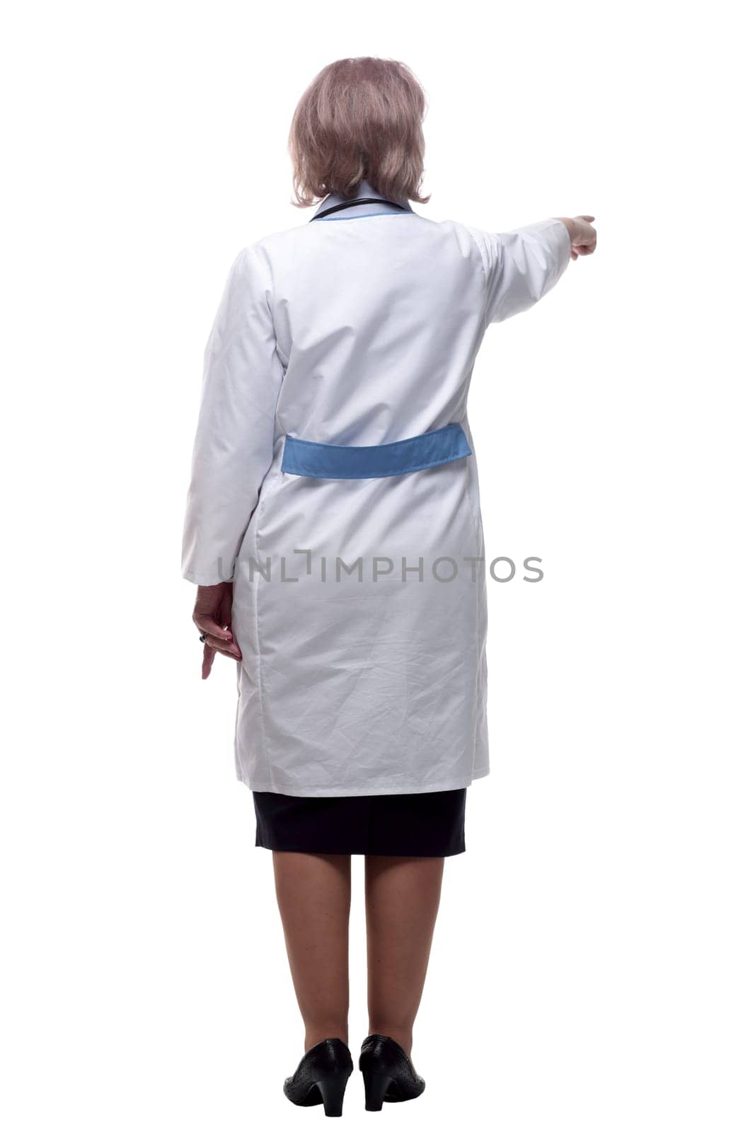 woman doctor standing in front of a white wall . isolated on a white by asdf