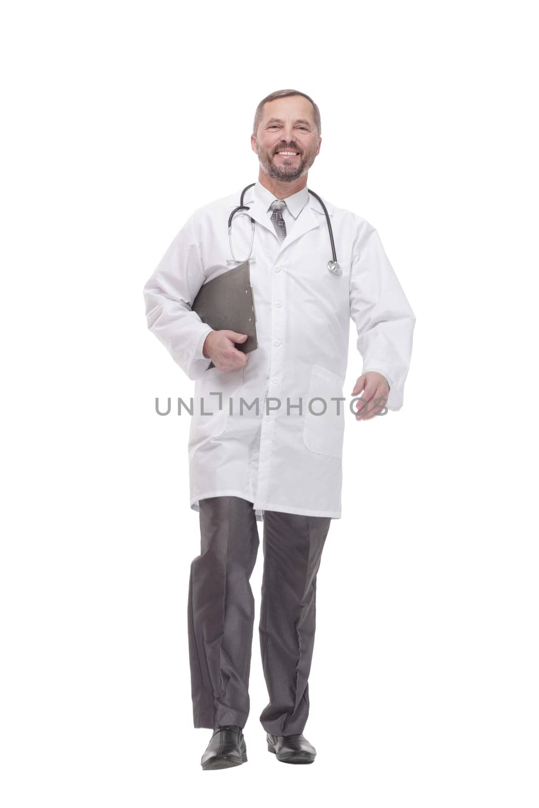 in full growth. smiling doctor with clipboard . isolated on a white background.