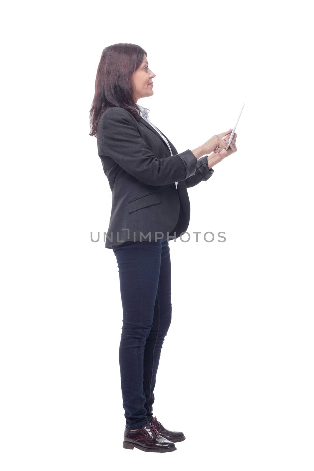 Full length portrait of attentive modern business woman with clipboard and pen looking at camera