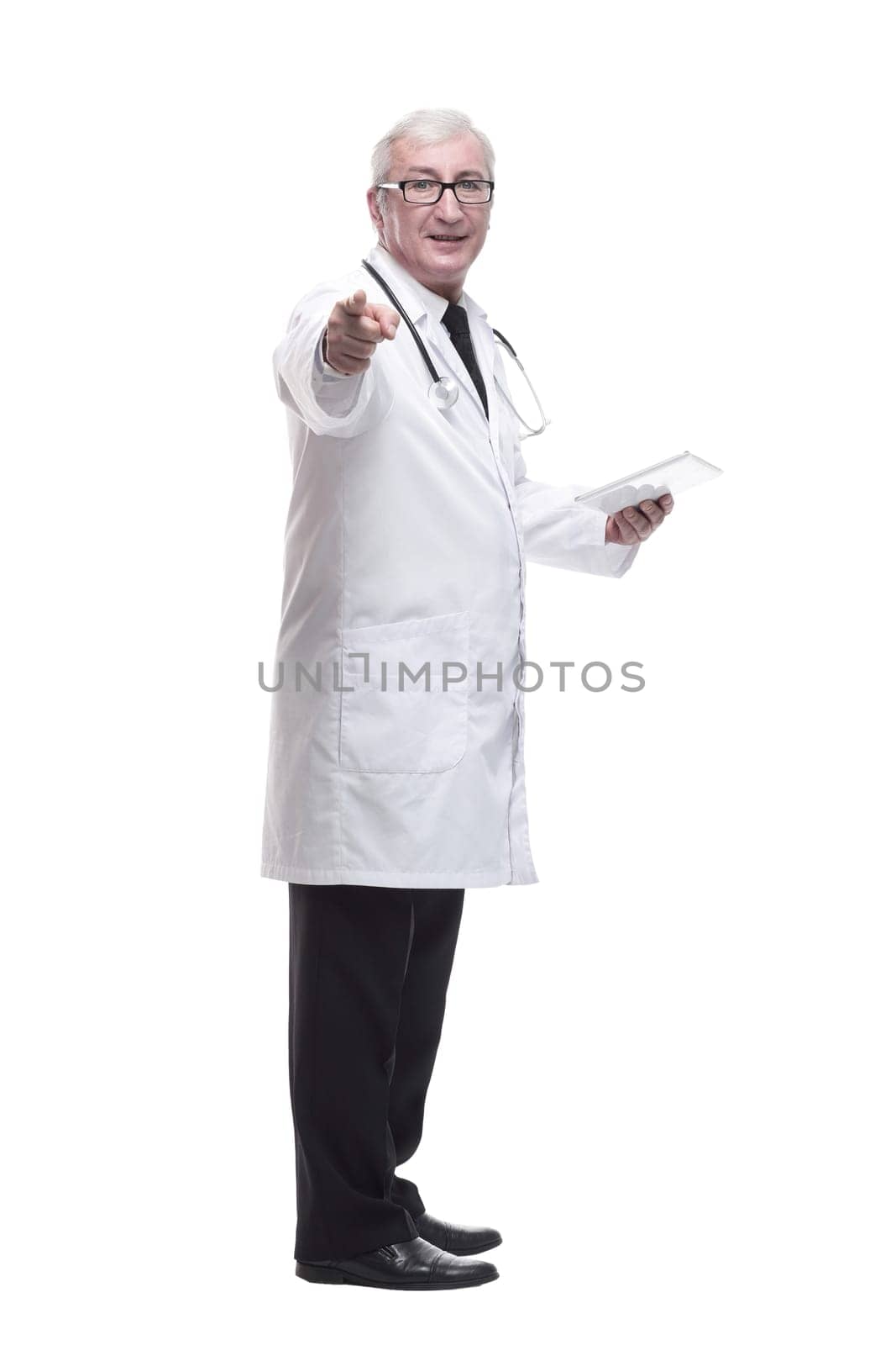 in full growth.qualified mature doctor with digital tablet . isolated on a white background.