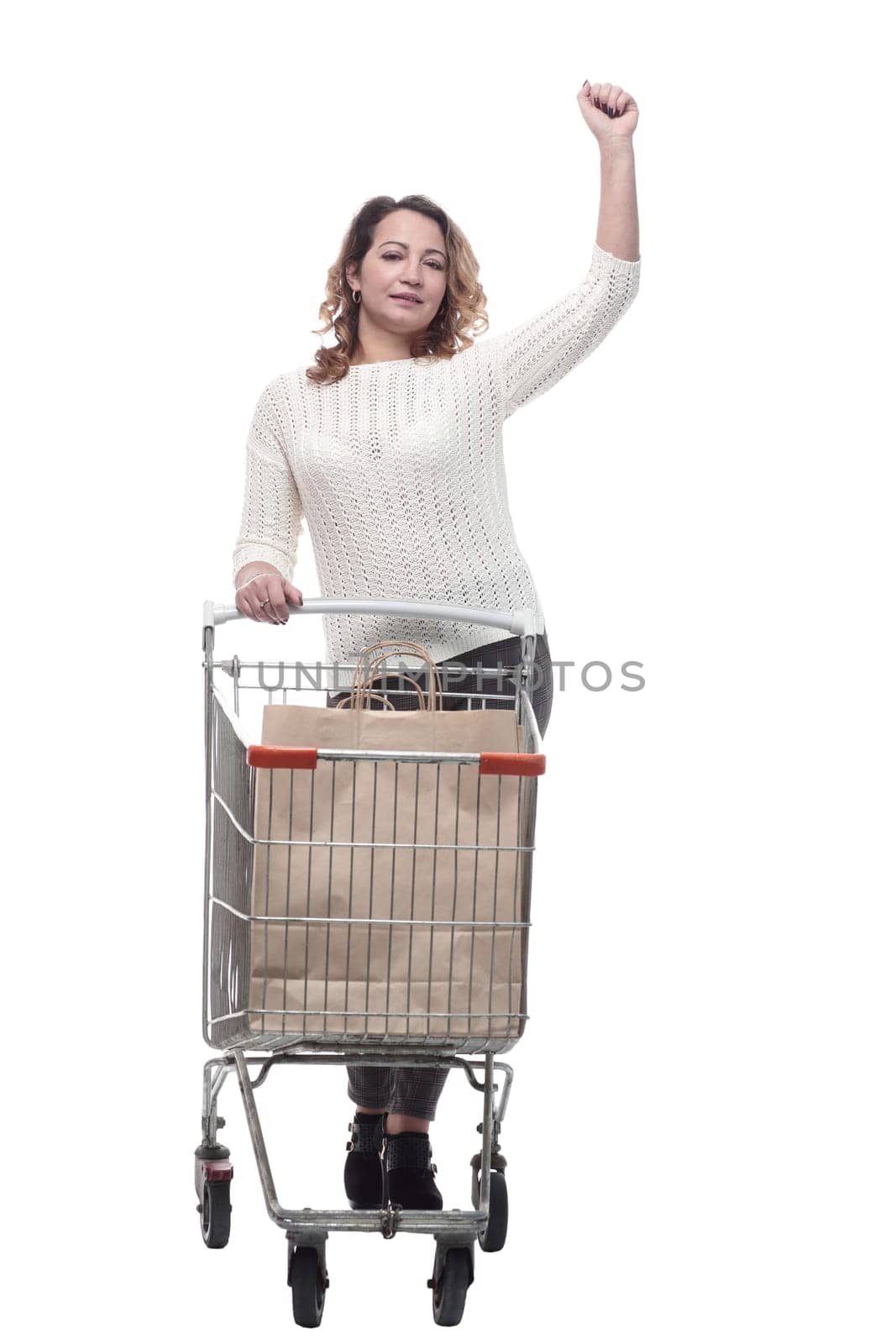 casual young woman with shopping cart. isolated on a white by asdf