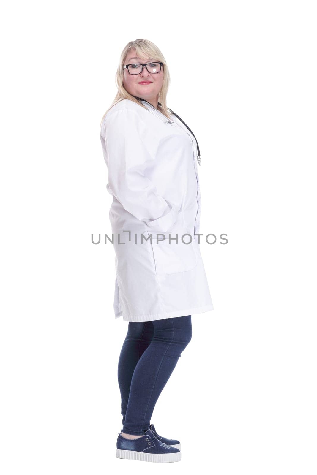 in full growth. smiling female doctor with a stethoscope. isolated on a white background.