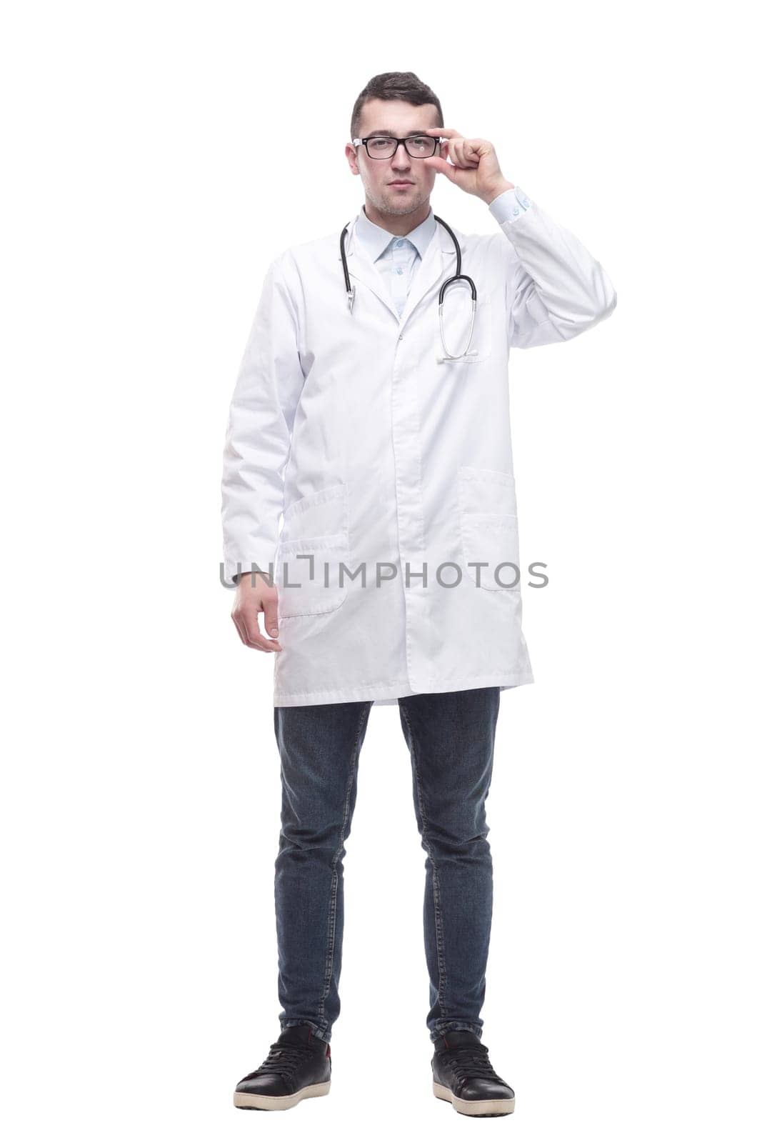 in full growth. a successful male doctor with a stethoscope . isolated on a white background.
