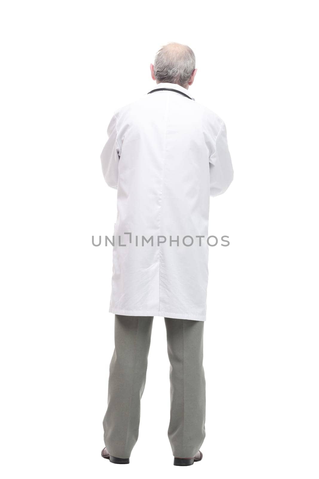 in full growth. elderly competent doctor with a stethoscope. isolated on a white background.