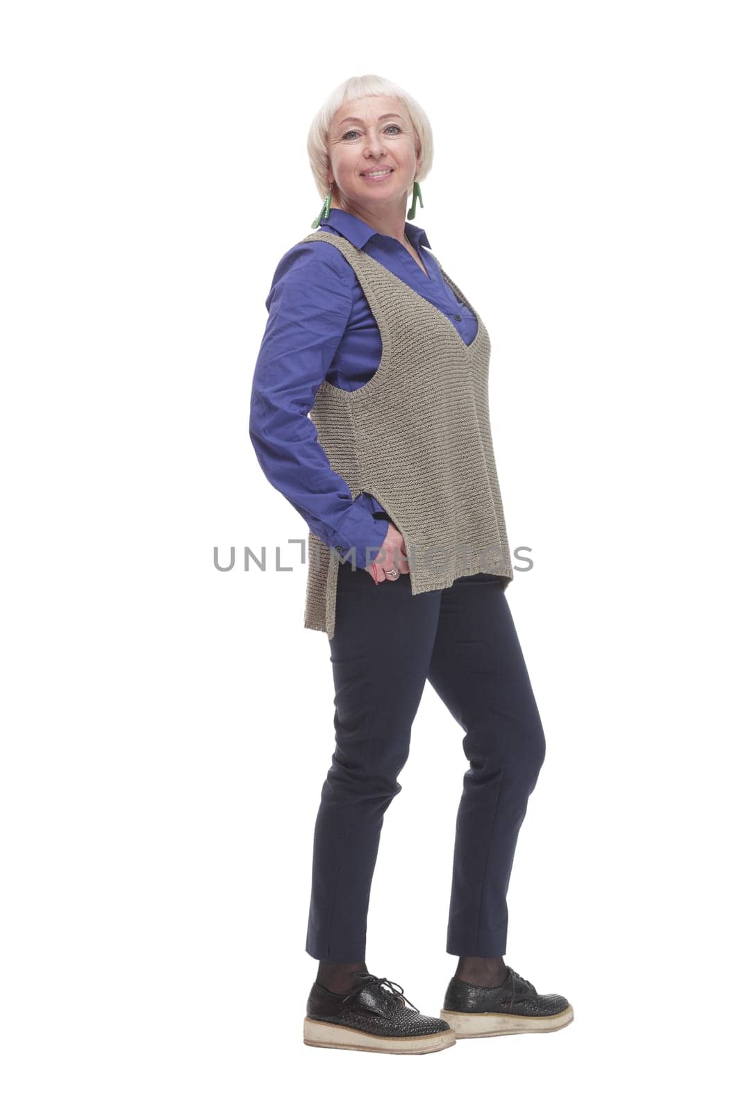 in full growth. attractive Mature woman in a gray vest. isolated on a white background.