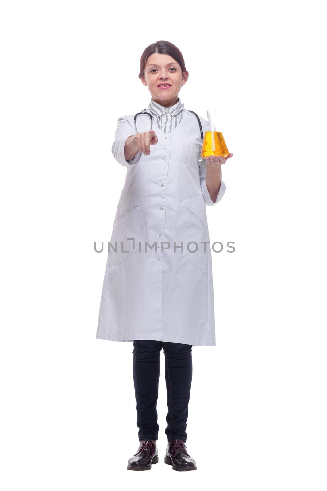 Beautiful woman doctor with yellow liquid in a flask. Chemical experiments concept