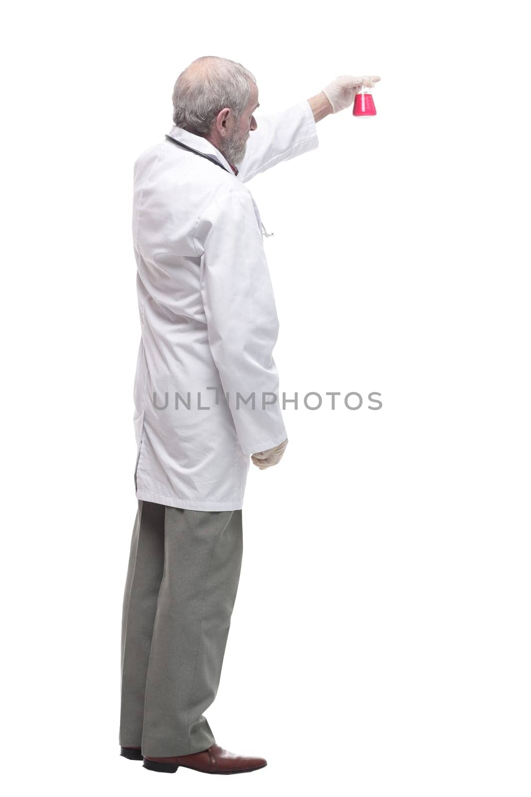 elderly competent doctor with a laboratory flask in his hands. isolated on a white background.