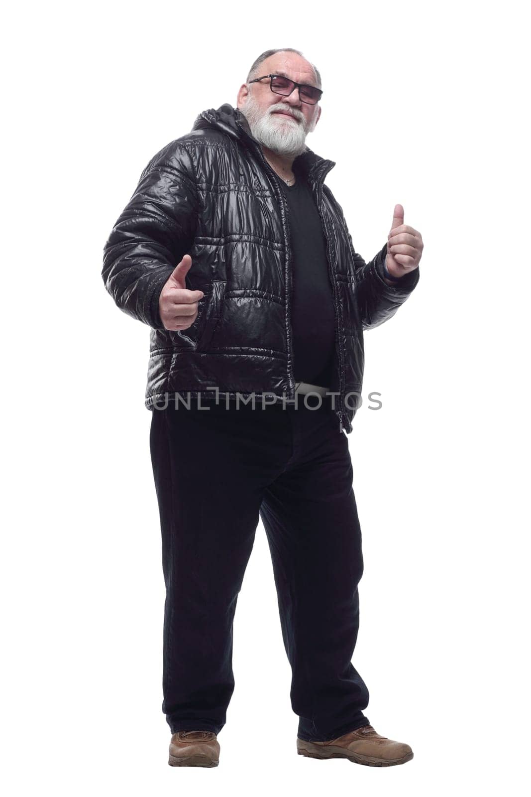 in full growth. contented bearded man in a winter jacket giving a thumbs up. isolated on a white background.