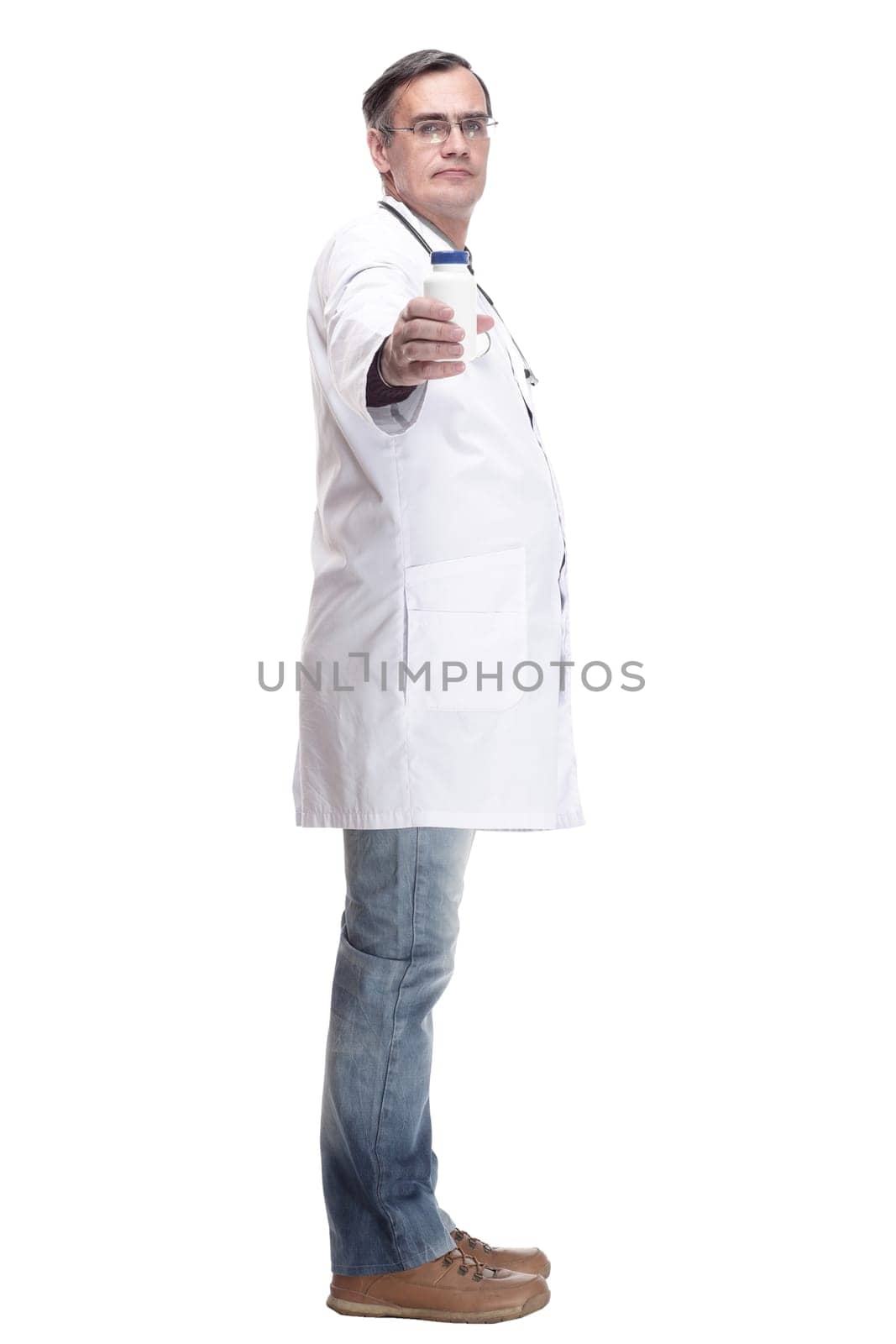 in full growth.qualified doctor with sanitizer in hand. isolated on a white background.