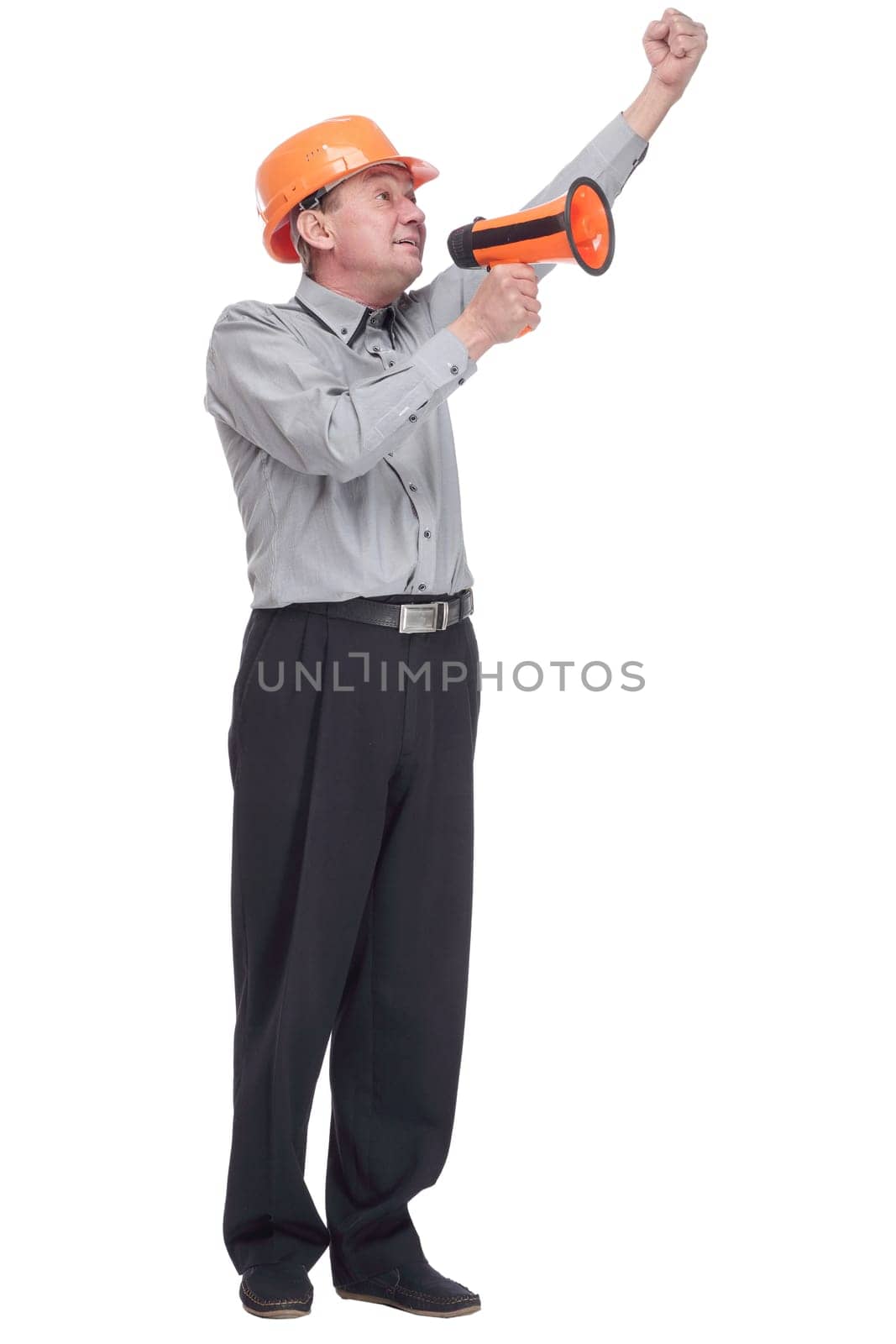 in full growth. an architect making an ad through a megaphone . isolated on a white background.