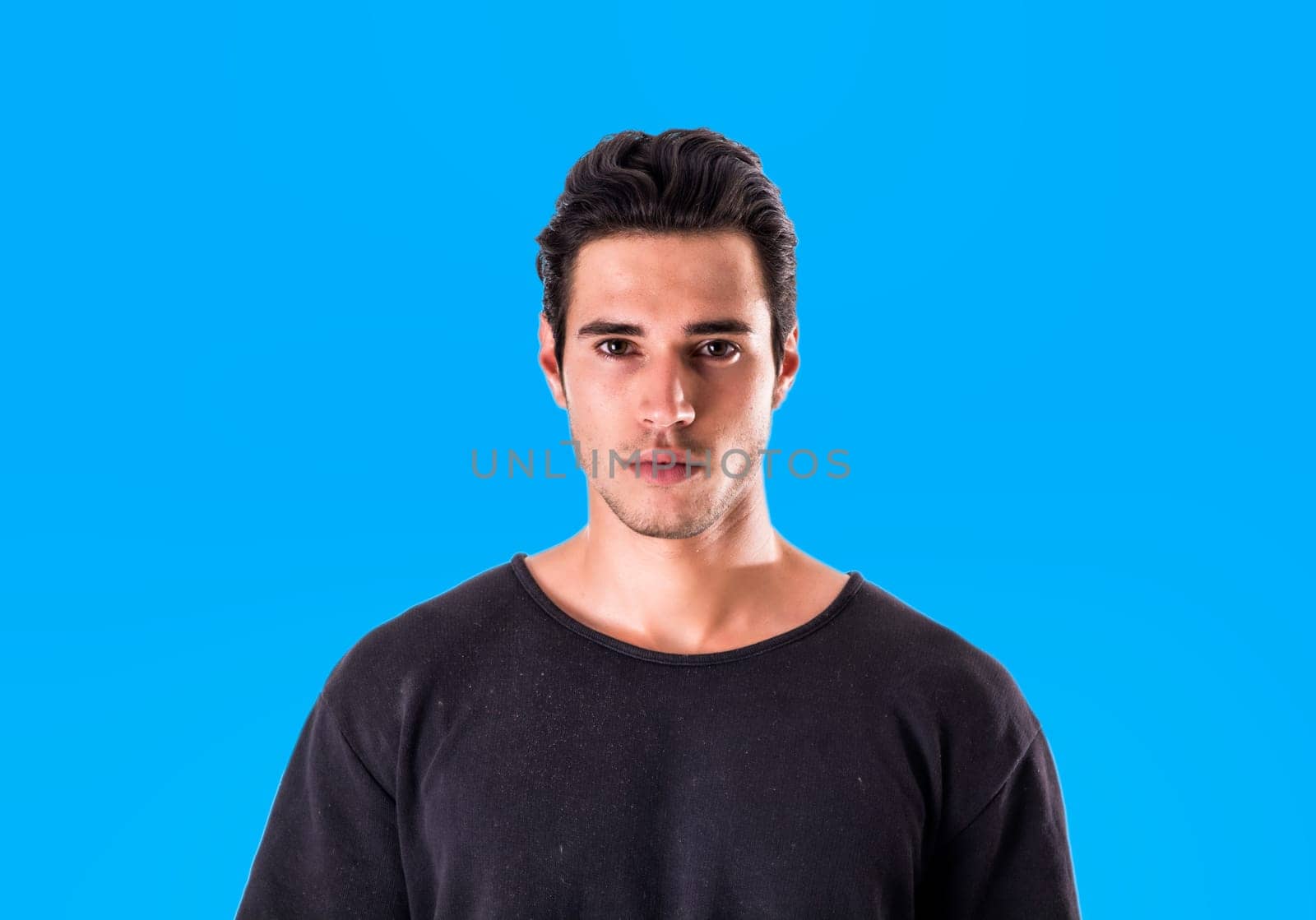 A man in a black shirt posing for a picture