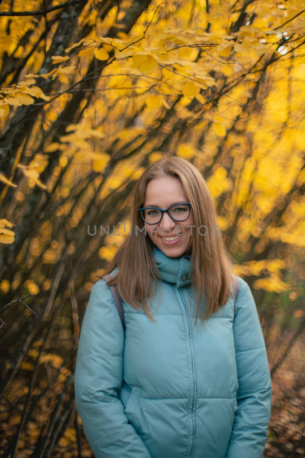 Autumn portrait of beautiful woman on fall nature background