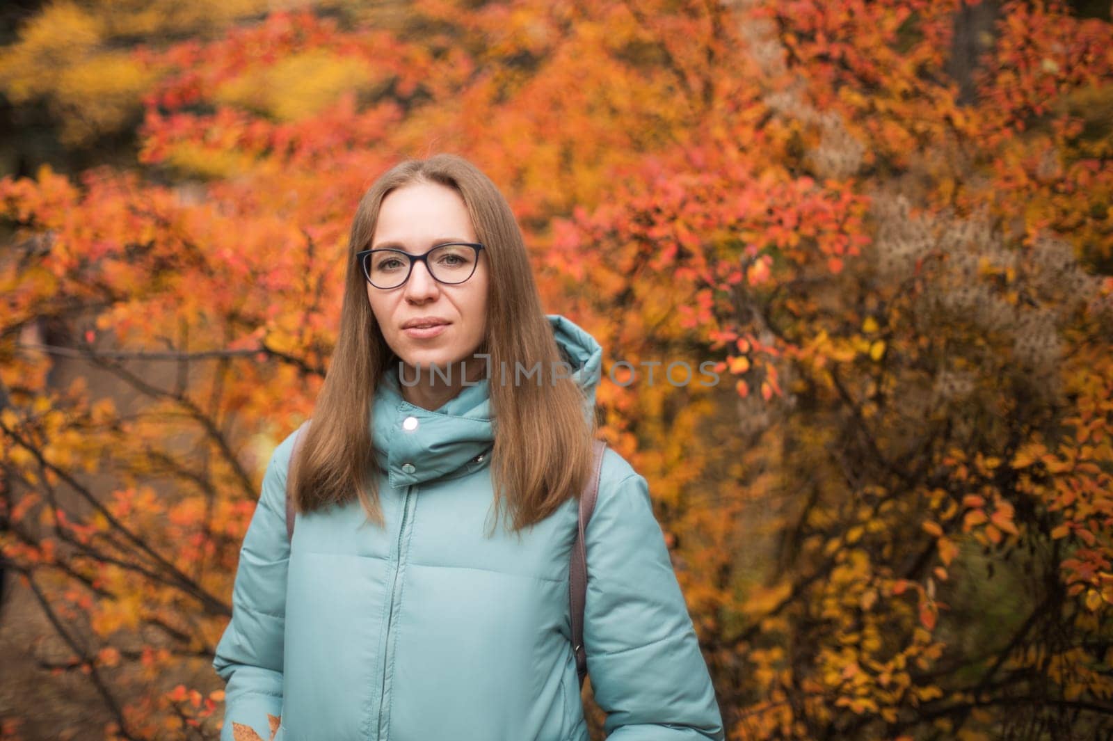 Autumn portrait of beautiful woman on fall nature background