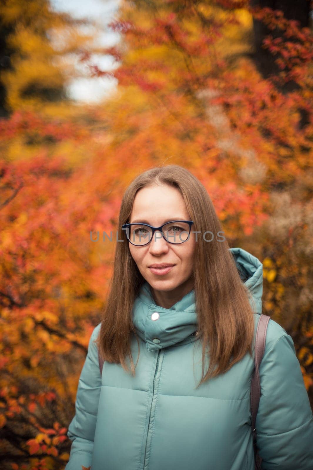 Autumn portrait of beautiful woman on fall nature background