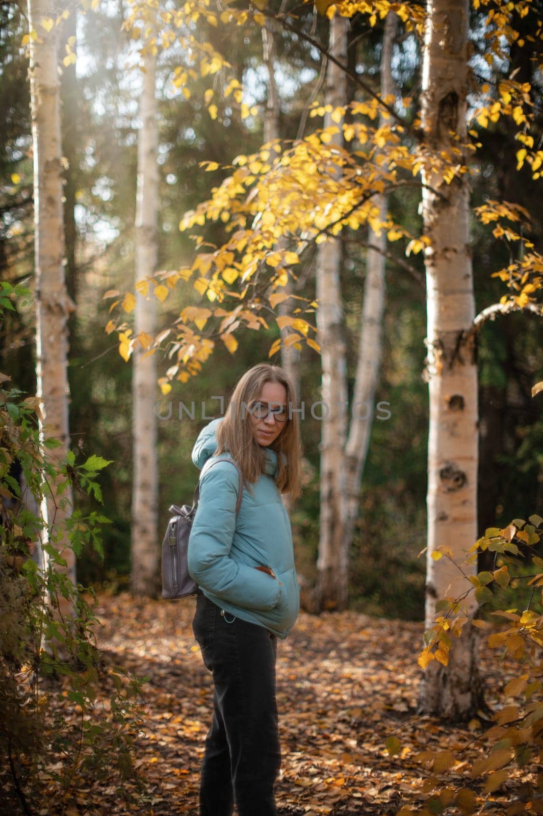 Autumn portrait of beautiful woman on fall nature background