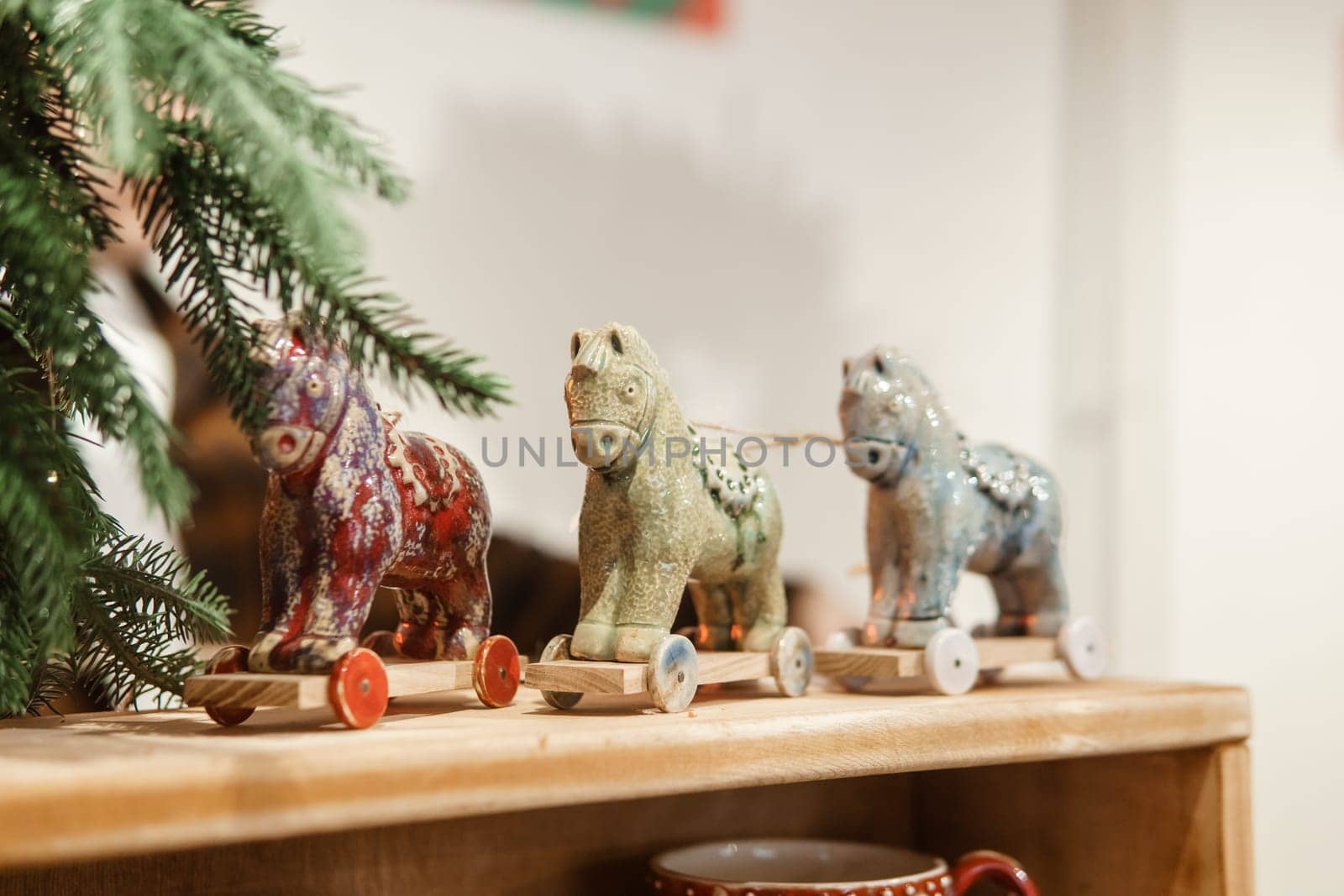 Sale of handmade ceramic Christmas tree toys at the Christmas Fair. Black Friday for the winter holidays