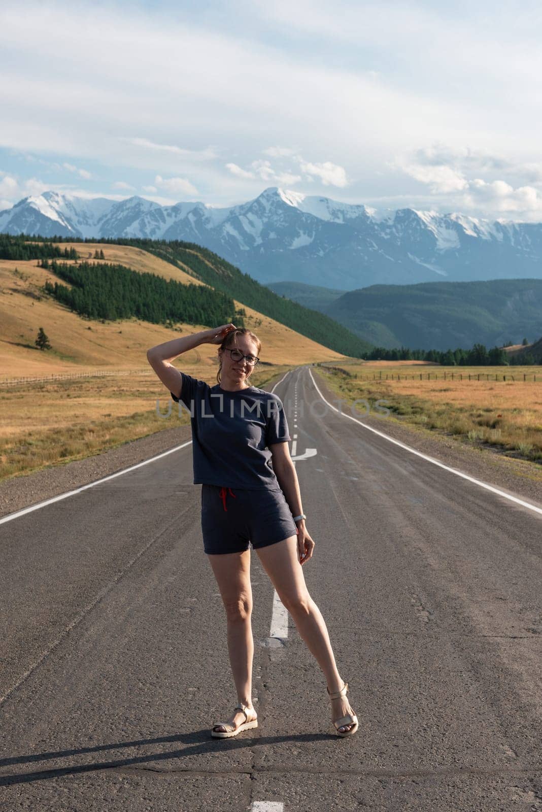 Woman om the Chuysky trakt road in the Altai mountains. One of the most beautiful road in the world.