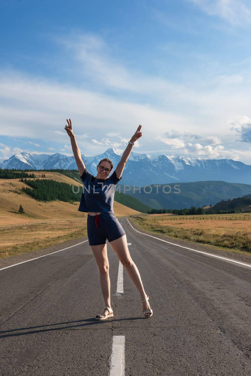 Woman om the Chuysky trakt road in the Altai mountains. One of the most beautiful road in the world.
