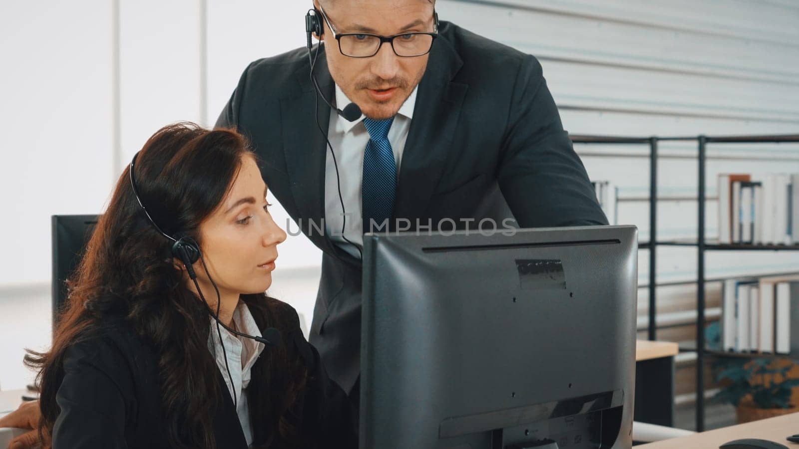 Business people wearing headset working in office Jivy by biancoblue