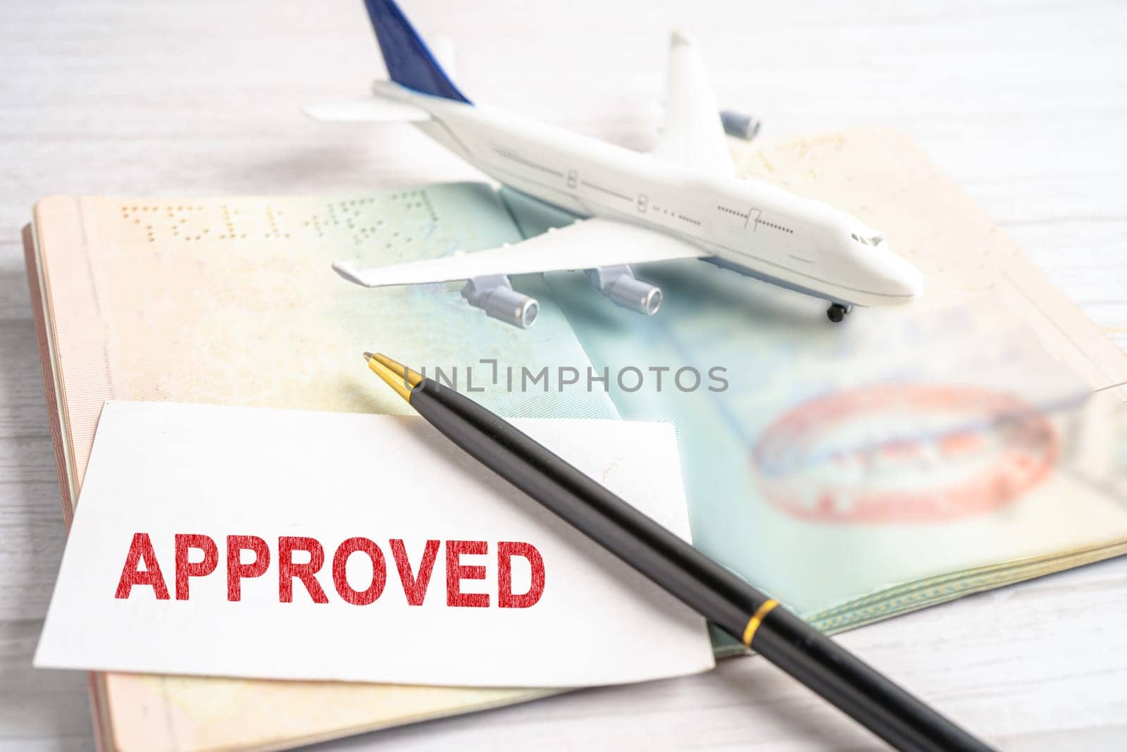 Approved Stamp visa and passport document to immigration at airport in country. by pamai